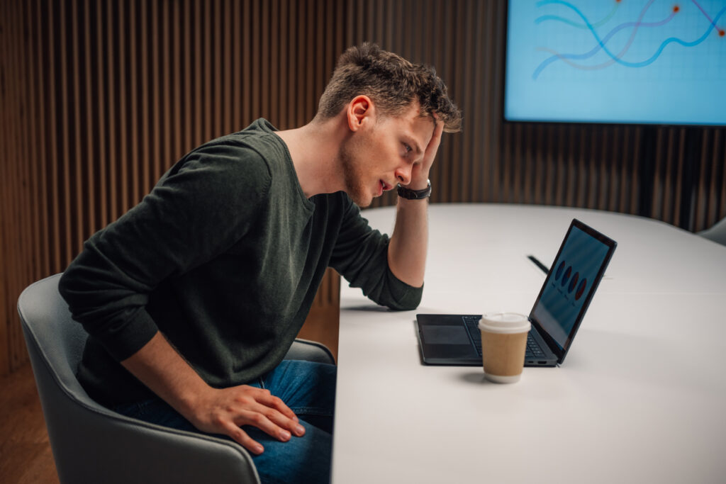 Newcastle business owner reviewing marketing campaign performance on laptop