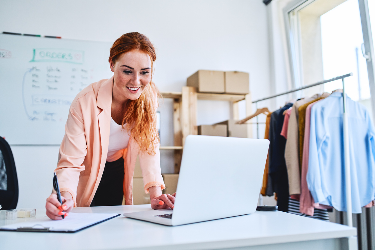 Small business owner reviewing website copy and customer-focused messaging