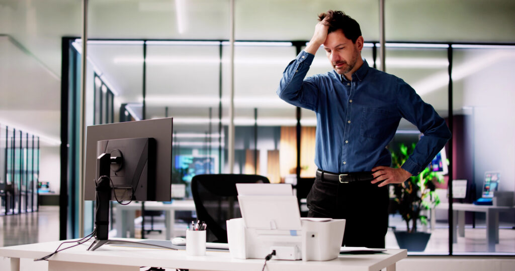 Frustrated business owner studying wasted PPC budget due to poor SEO foundation