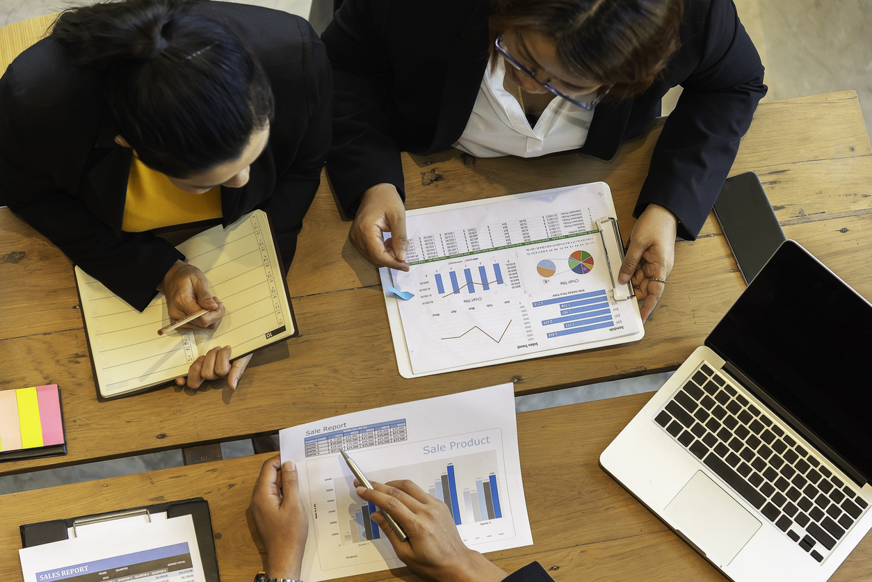 Executive reviewing a marketing agency financial audit report for 2027 pipeline growth.